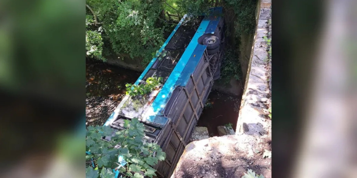 Bus falls 9 m from bridge into river